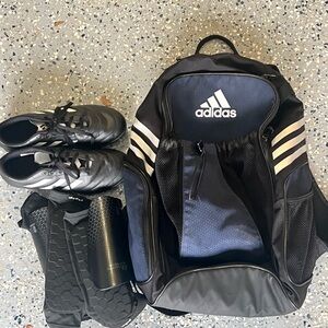 Adidas Black Backpack with Gold Accents and Durable Fabric